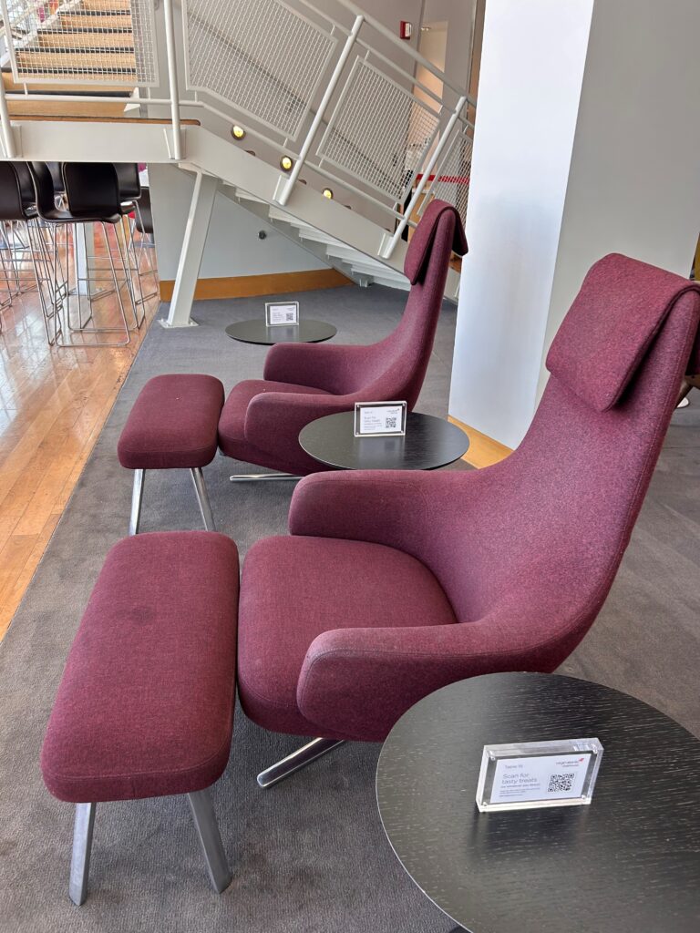 a group of chairs and tables in a room