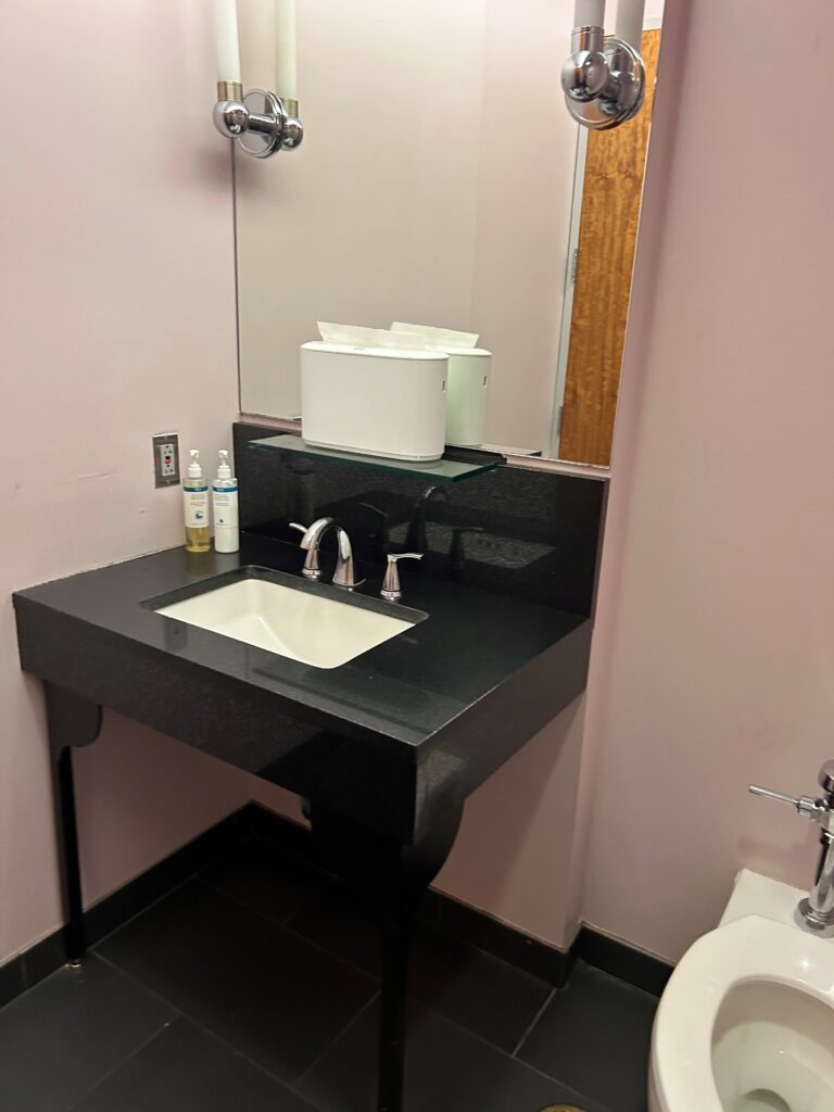 a bathroom with a sink and mirror