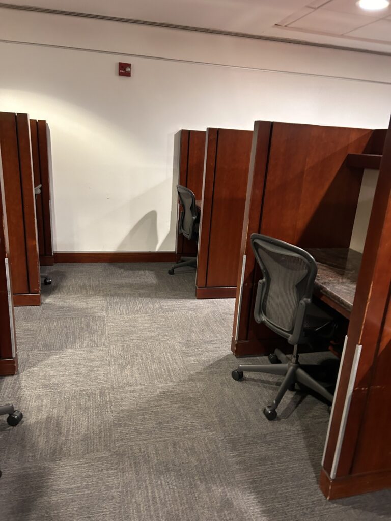 a room with chairs and desks