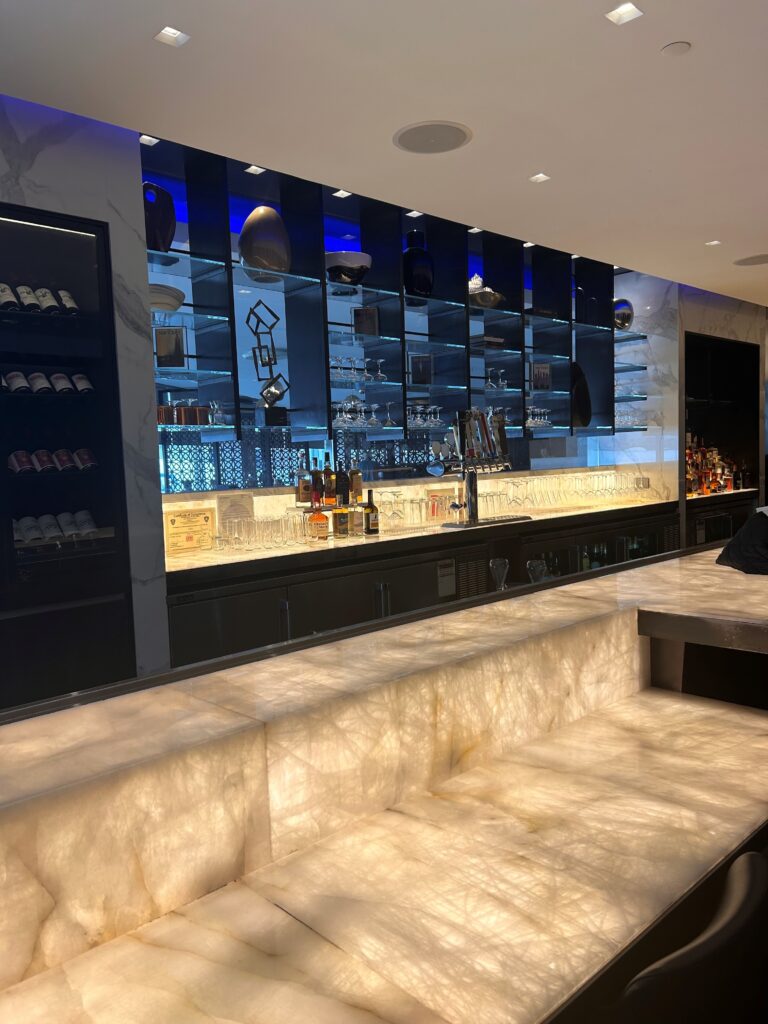 a bar with a counter and shelves