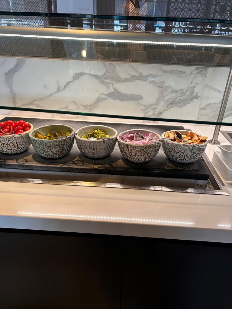 a row of bowls of food