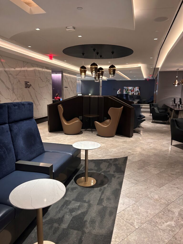 a lobby with chairs and tables
