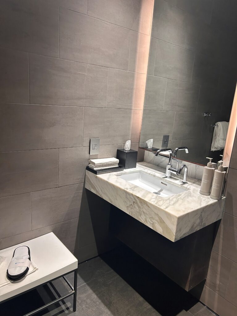a bathroom with a sink and mirror