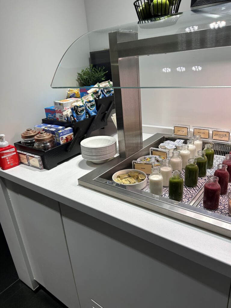 a counter with drinks and milk