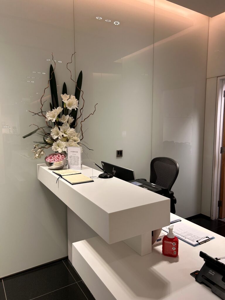 a white desk with flowers on it