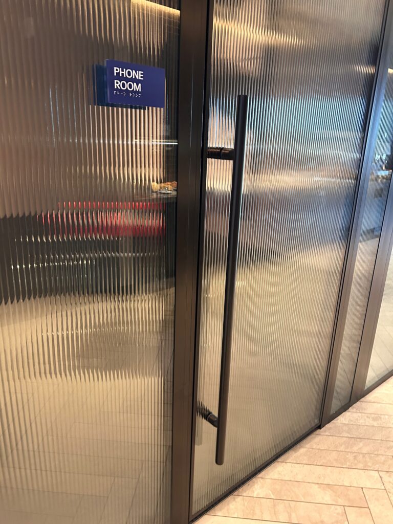 a glass doors with a sign on the side