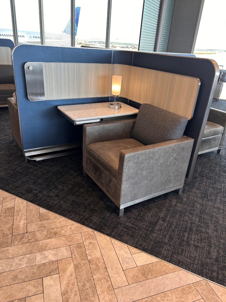 a booth with a table and a lamp