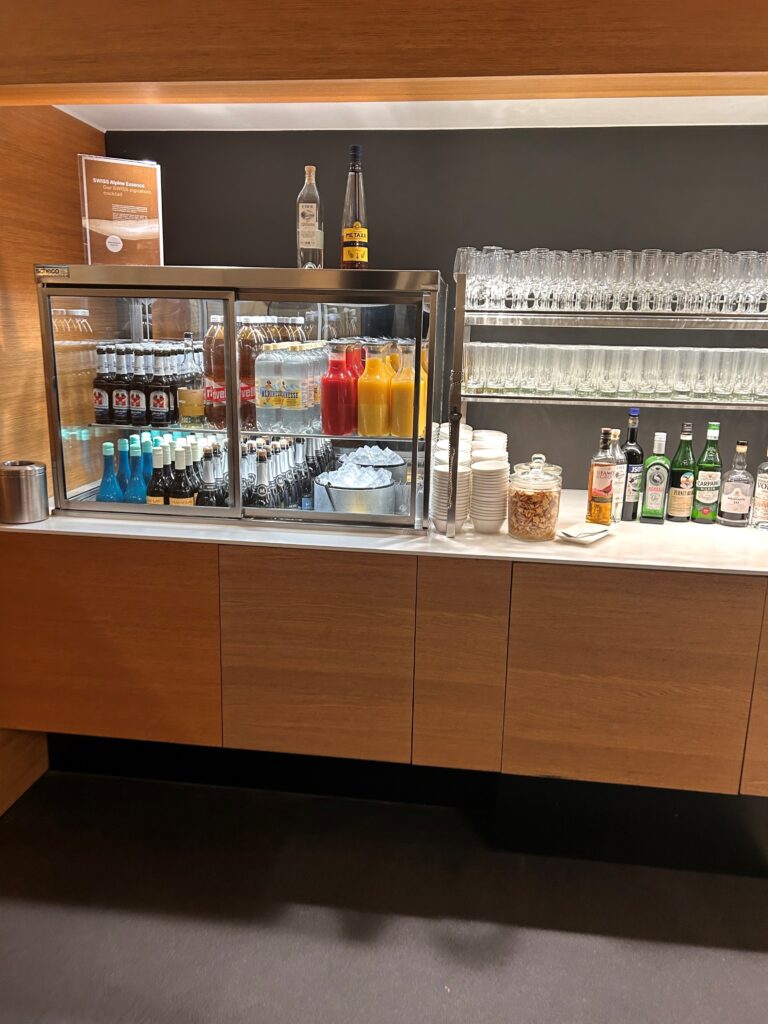 a bar with drinks and glasses