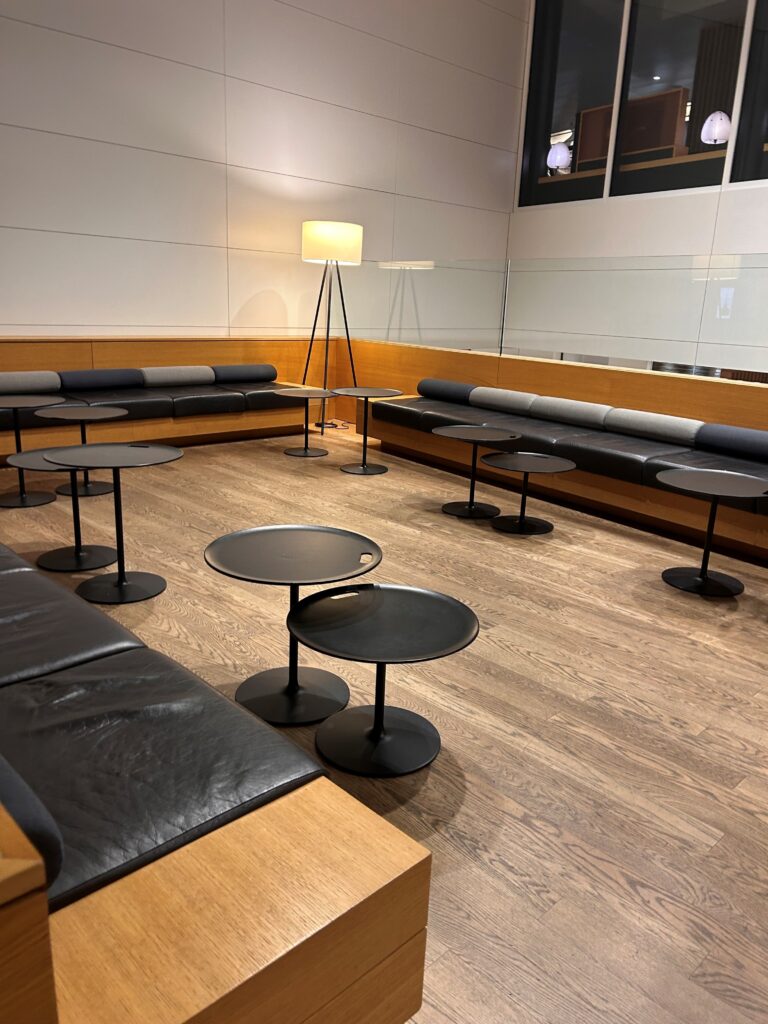 a room with tables and benches