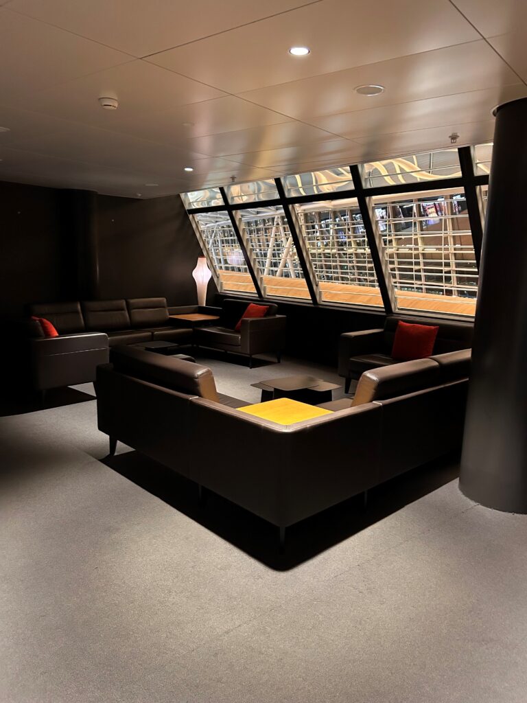 a room with couches and a window