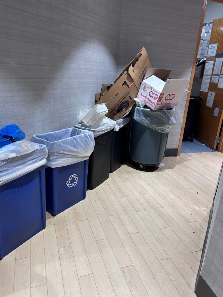 a group of trash cans in a room