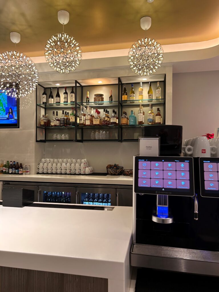 a bar with a variety of bottles and a display