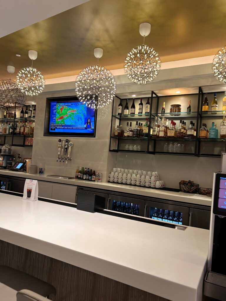 a bar with a television and shelves