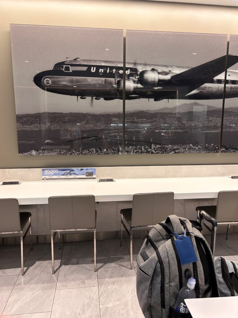 a backpack in front of a picture of an airplane
