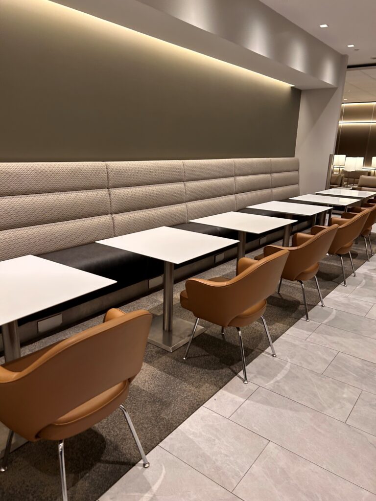 a row of tables and chairs in a restaurant