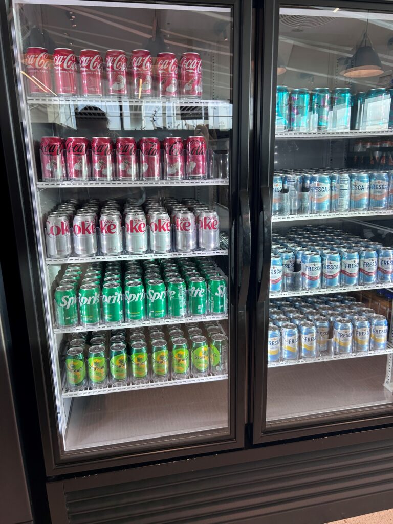 a cooler with cans of soda