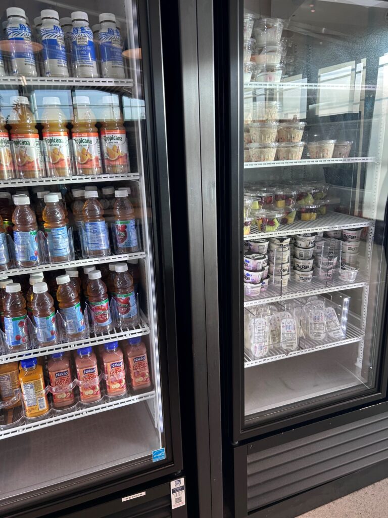 a refrigerator with drinks and beverages