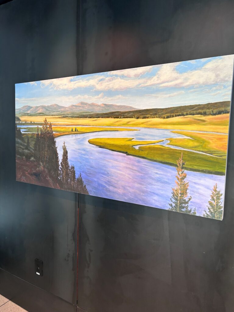 a painting of a river and mountains