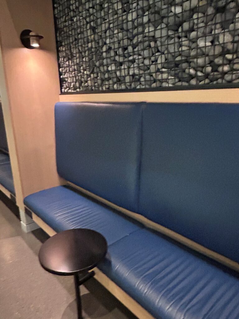 a blue bench with a stool