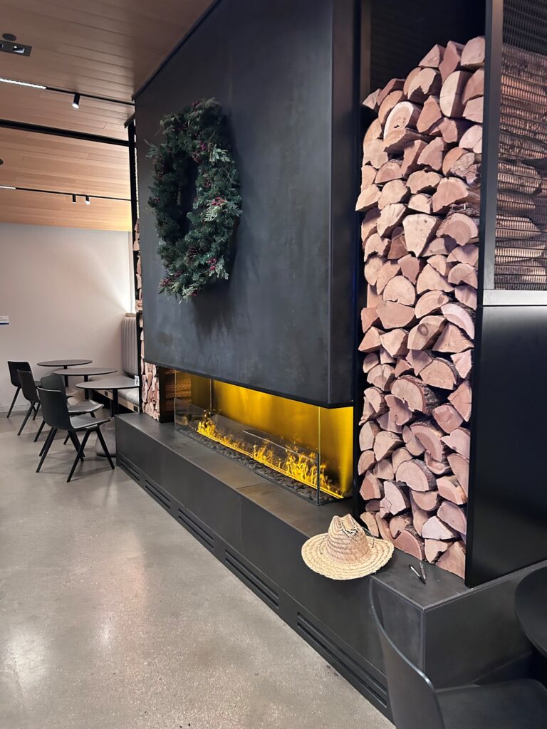 a fireplace with a wreath on the wall