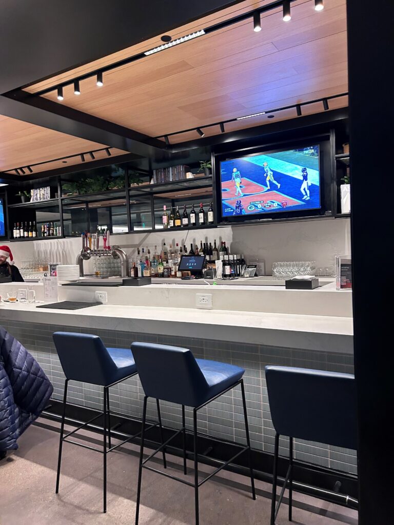 a bar with a television and a tv on the wall