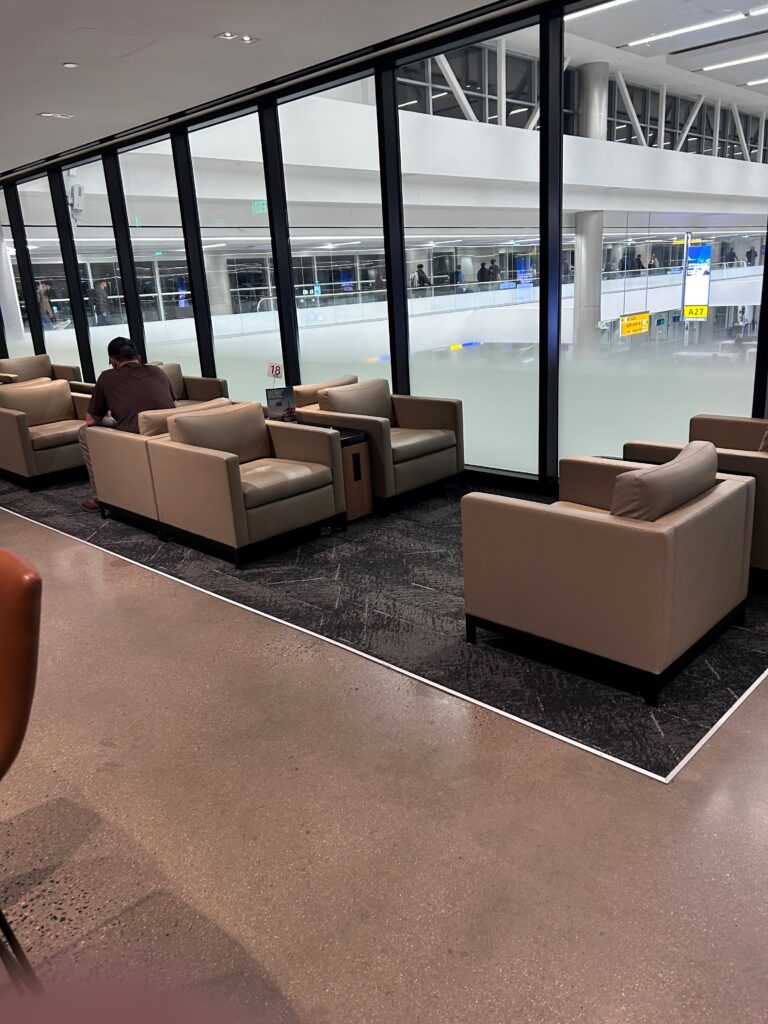 a room with chairs and a large window