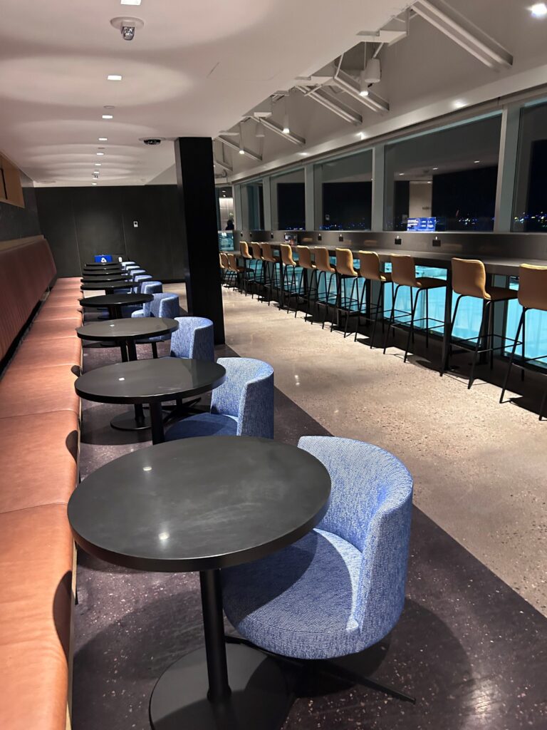 a row of tables and chairs in a room