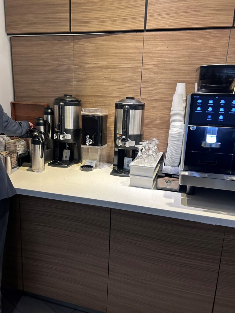 a coffee machine and cups on a counter