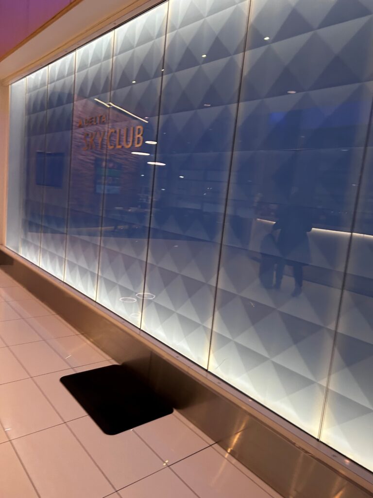 a glass wall with a sign on it