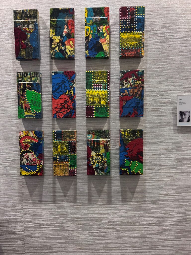 a group of art pieces on a wall