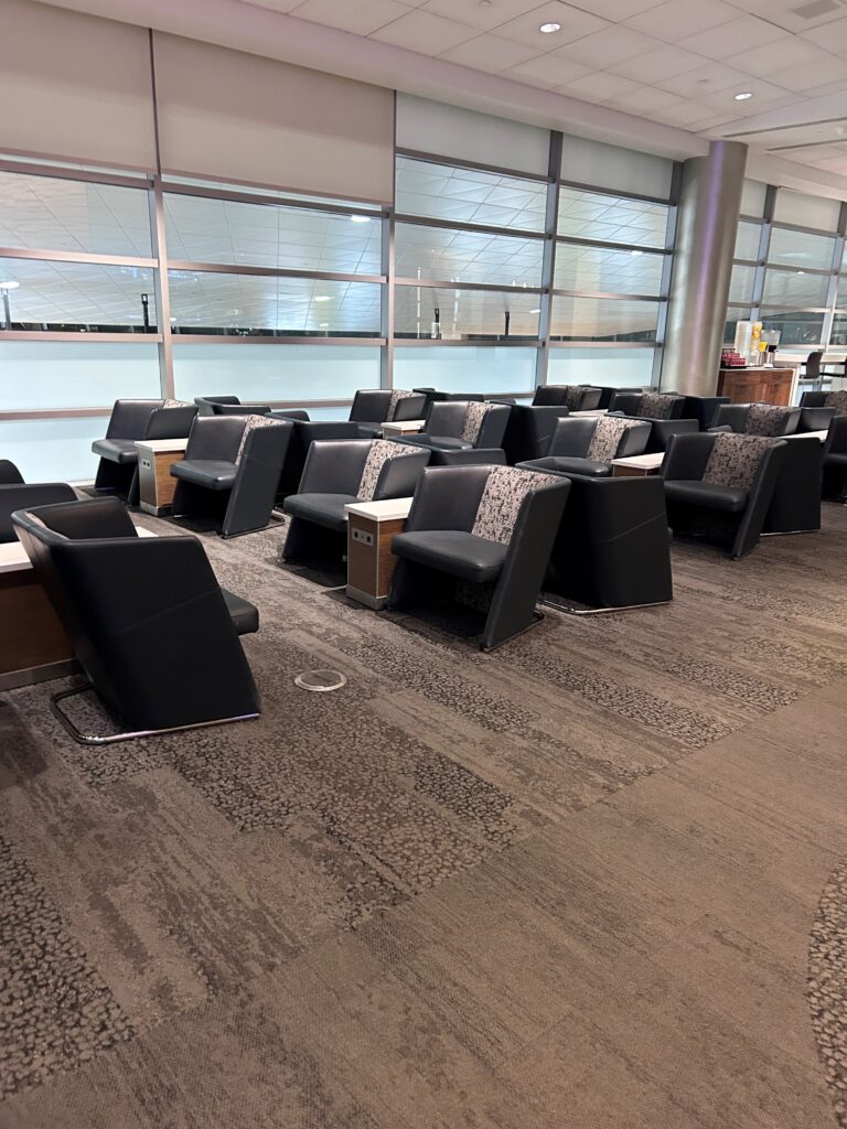 a room with many chairs and tables