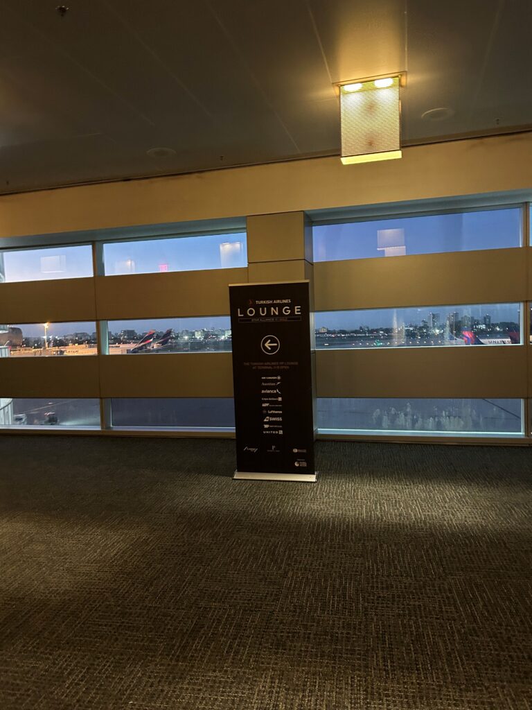 a sign in a room with windows