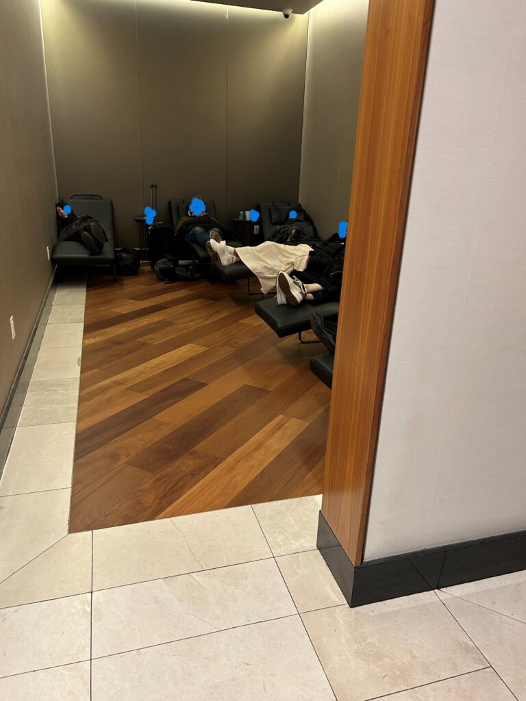 a group of people lying in chairs