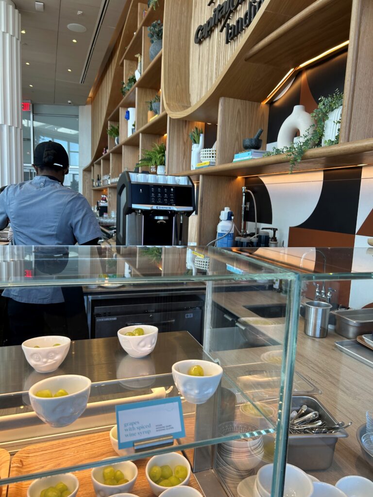 a man behind a counter in a restaurant