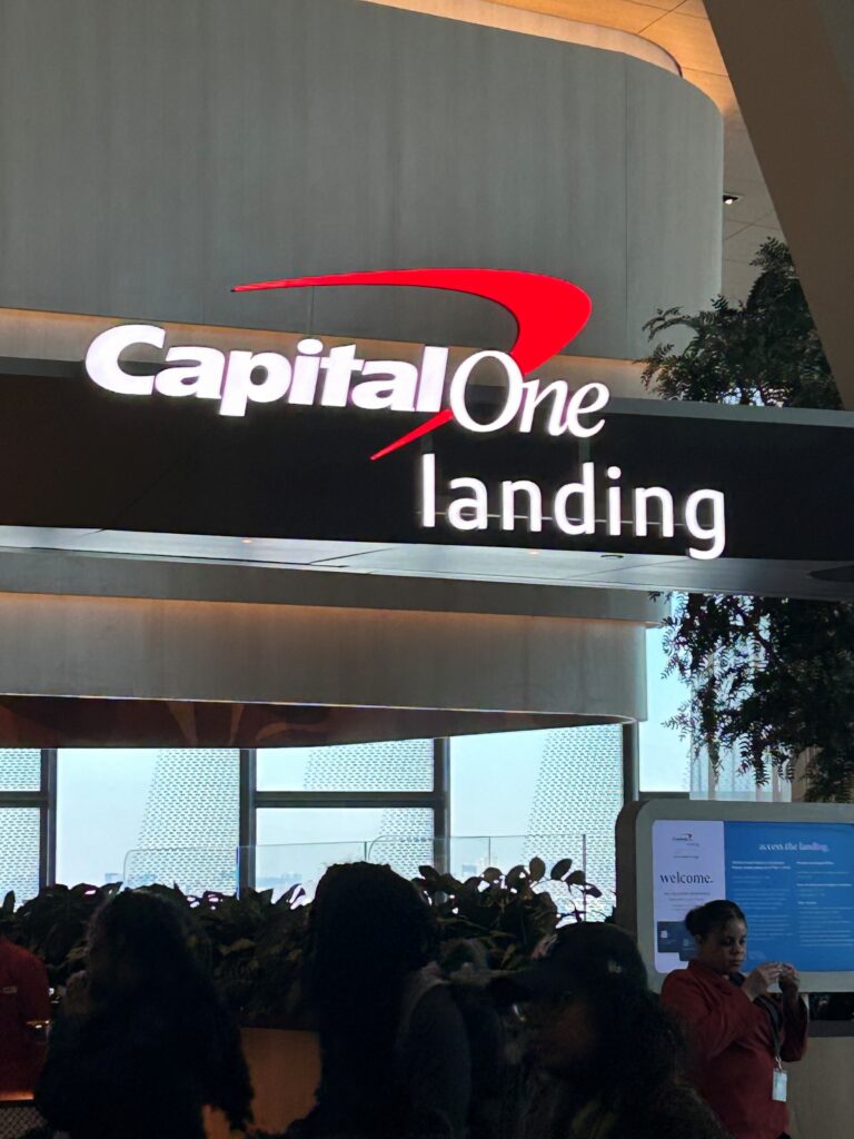 a sign with a group of people in front of it