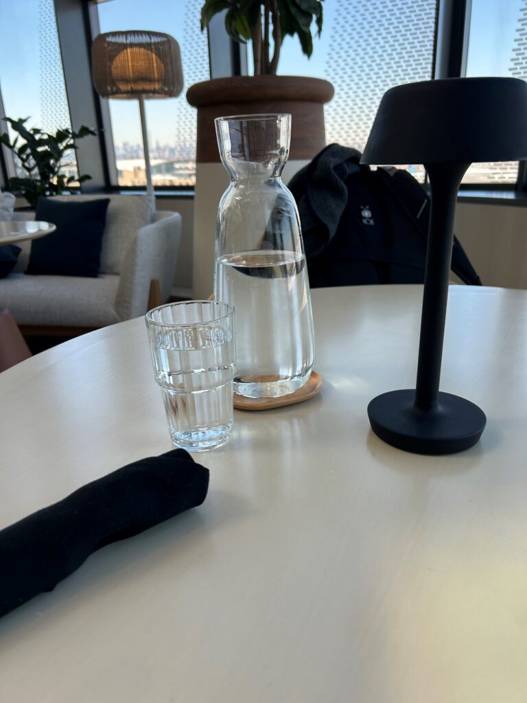 a glass and water on a table