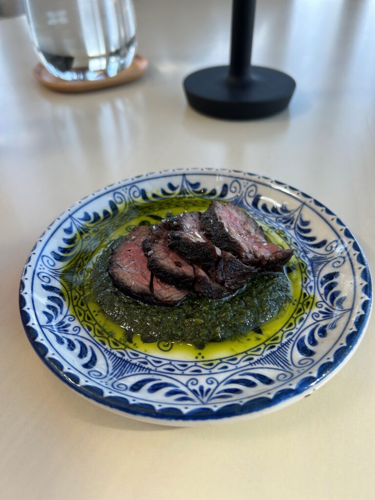 a plate of meat and sauce