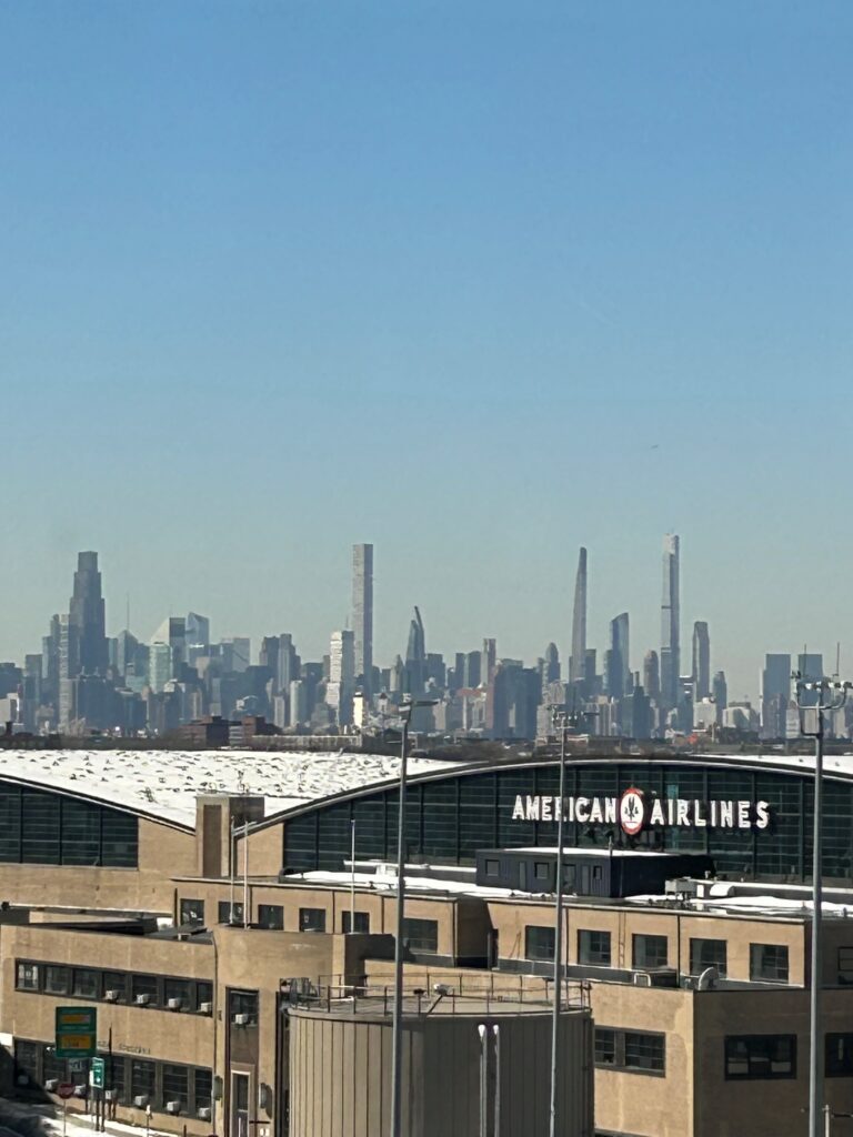 a large building with a city in the background