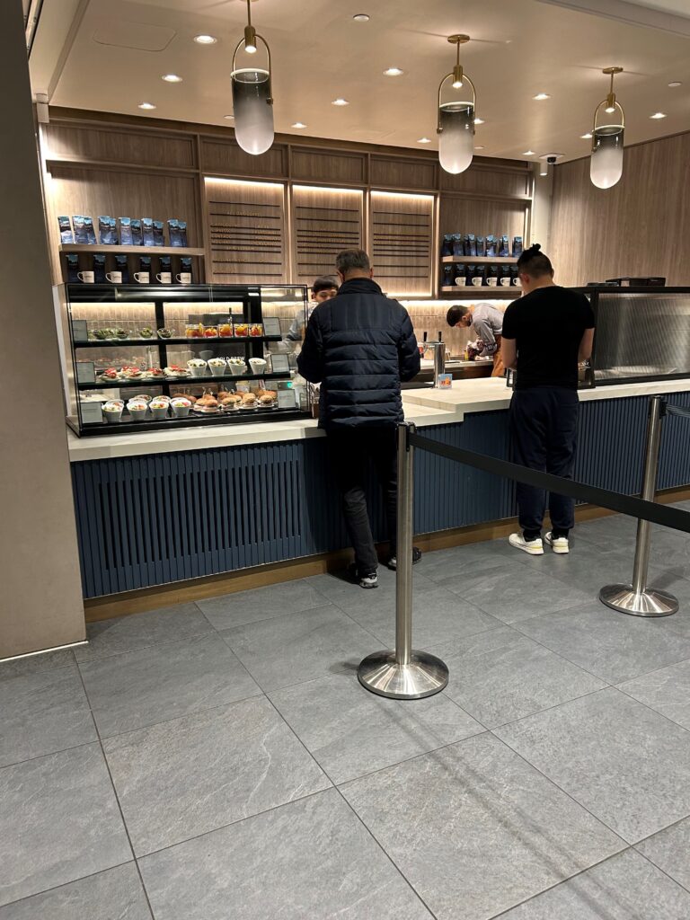 people standing in a line at a counter