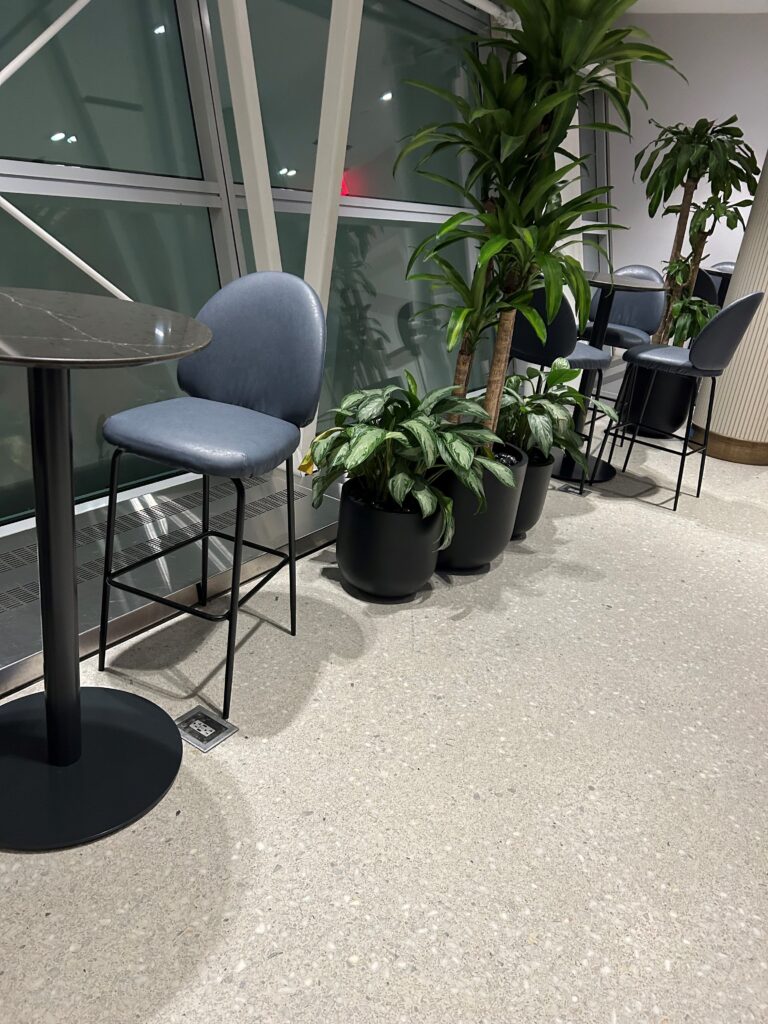 a group of chairs and a table in a room with a window