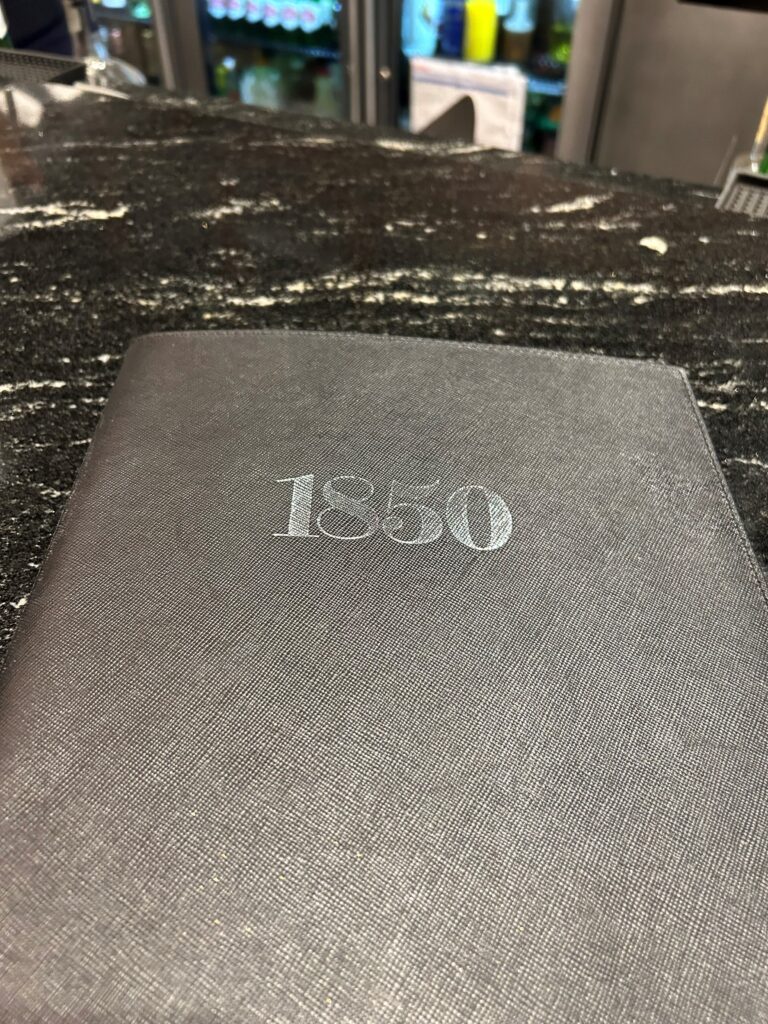 a black book on a marble counter