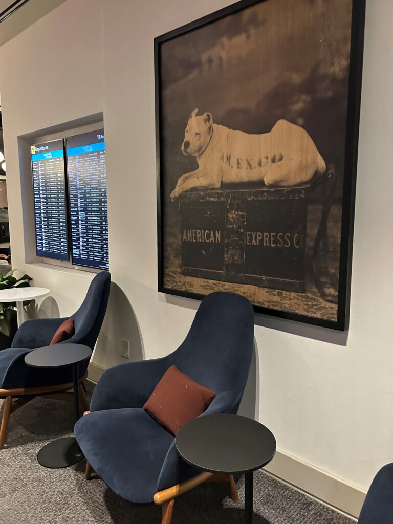 a framed picture of a dog on a crate in a room