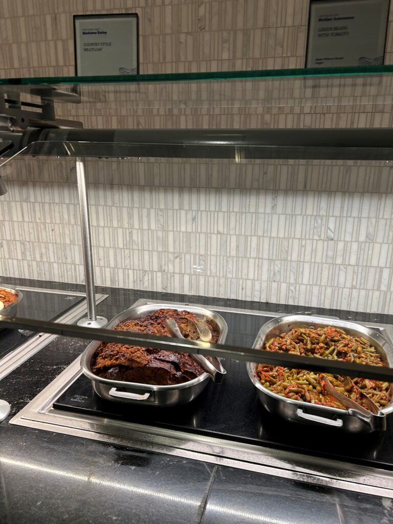 food in a buffet with a glass shelf