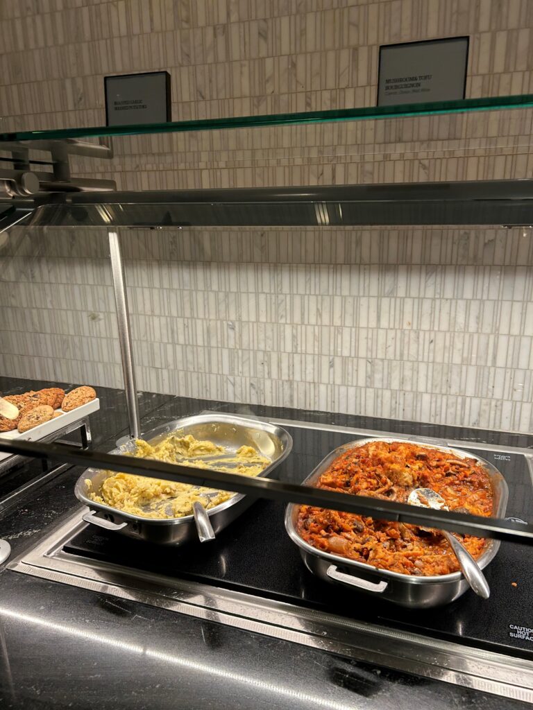 food in a buffet with a glass shelf