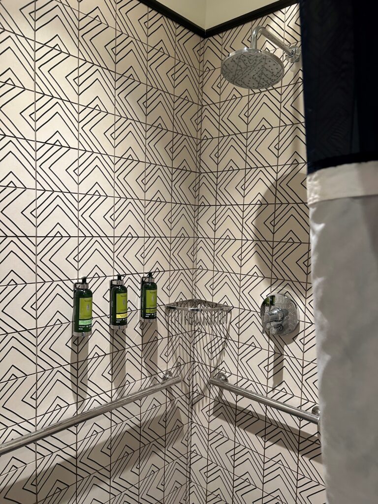 a shower with a shower head and shower head