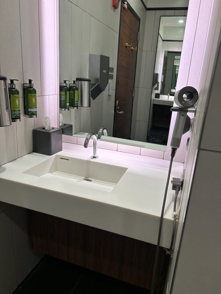 a bathroom sink with a mirror and a mirror