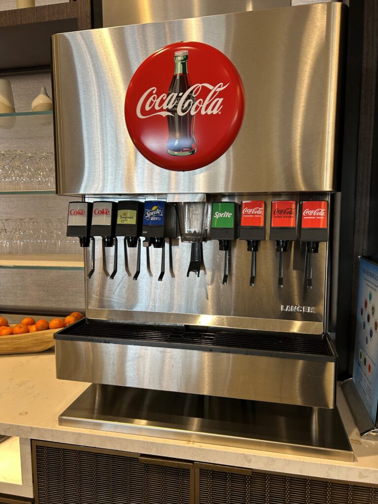 a soda dispenser with a logo on it