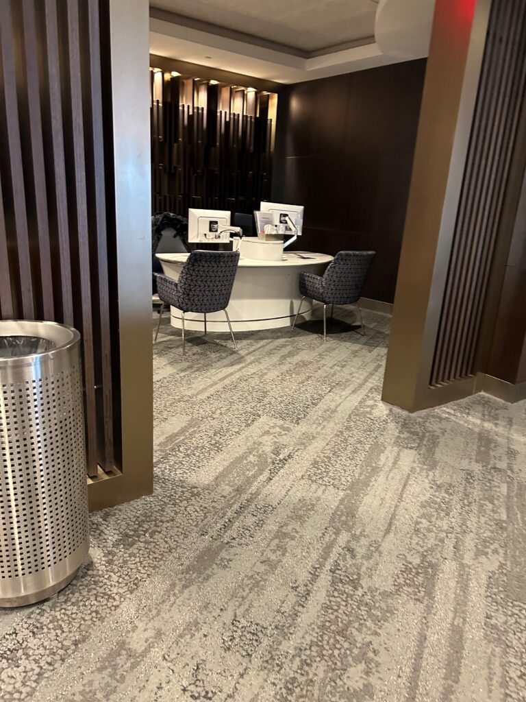 a room with a round table and chairs