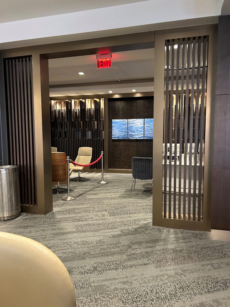 an open doorway with a red exit sign