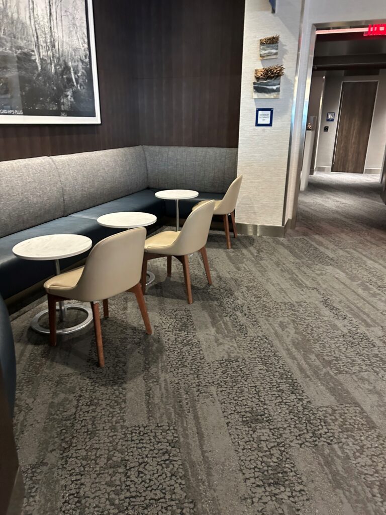 a room with a booth and tables